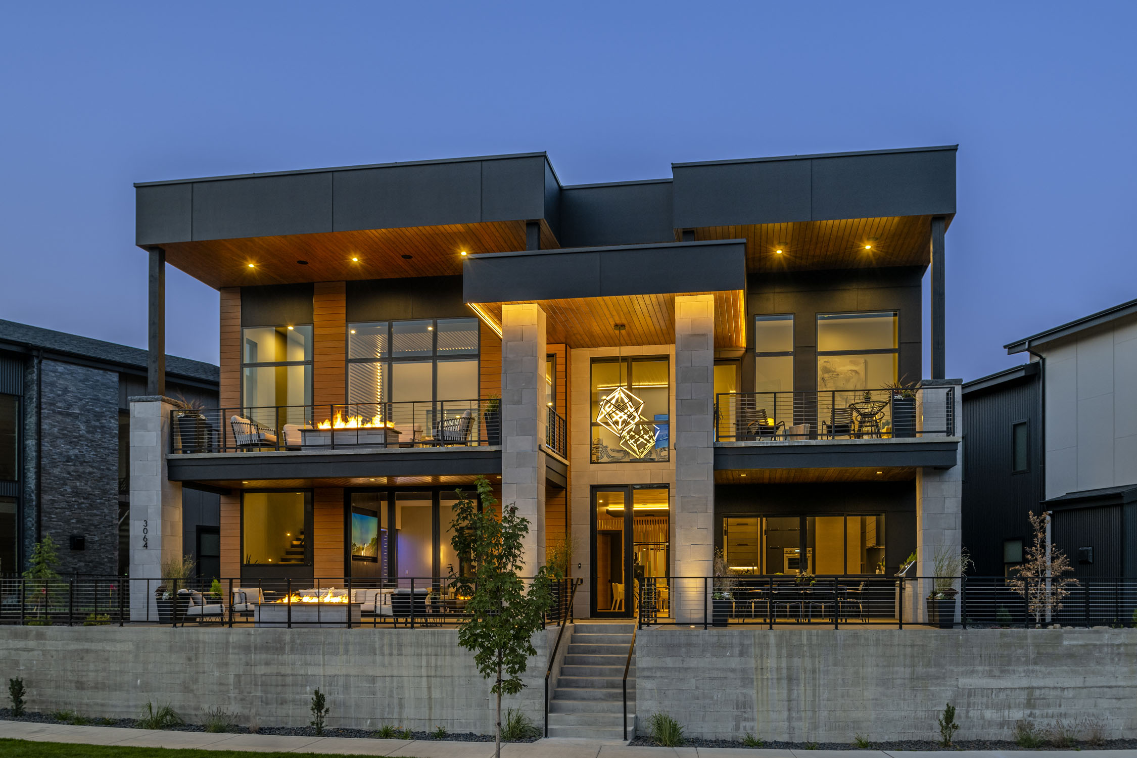 exterior view of The Glasgow luxury custom home illuminated at night
