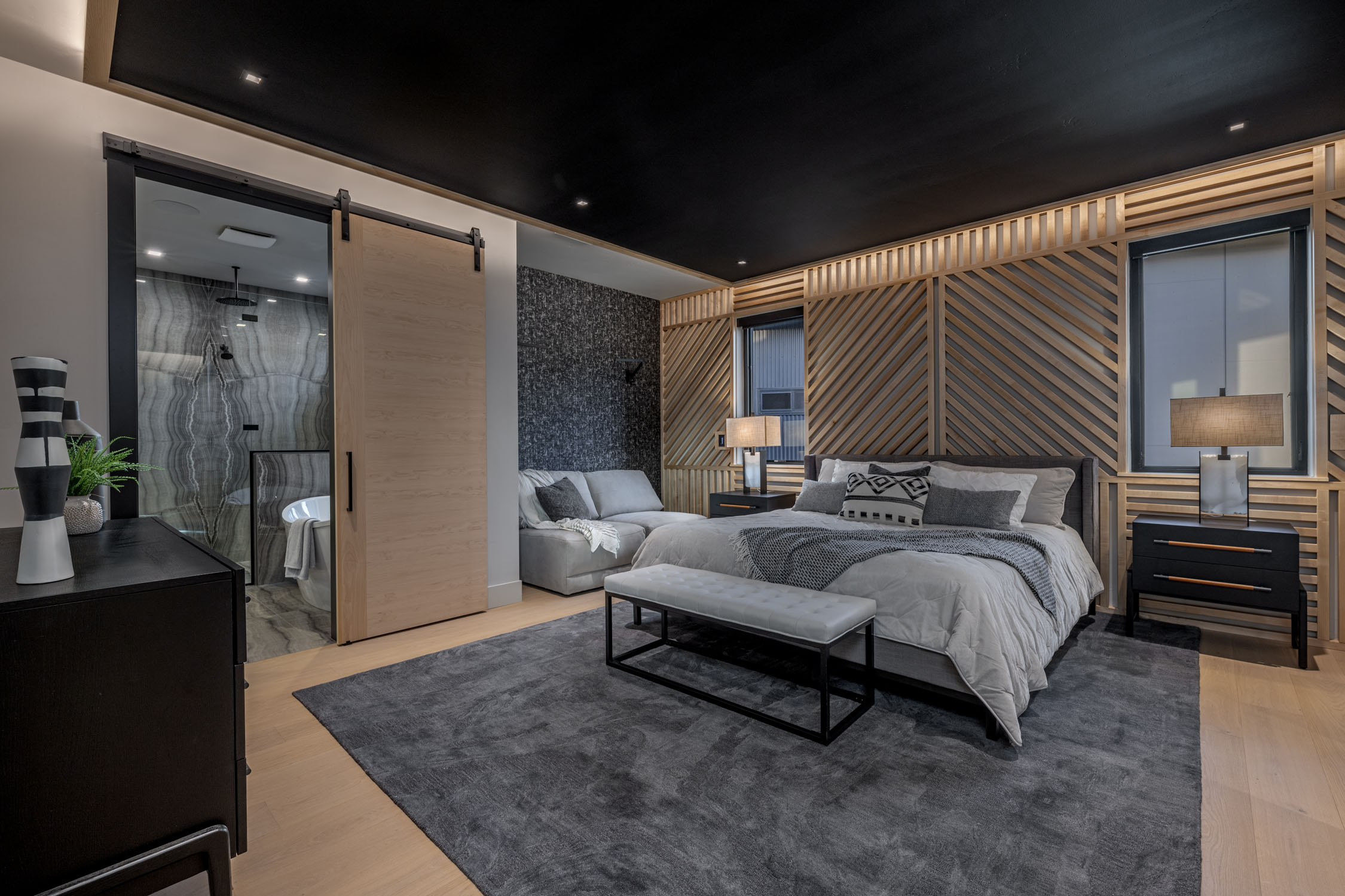 custom luxury primary bedroom with wood accents