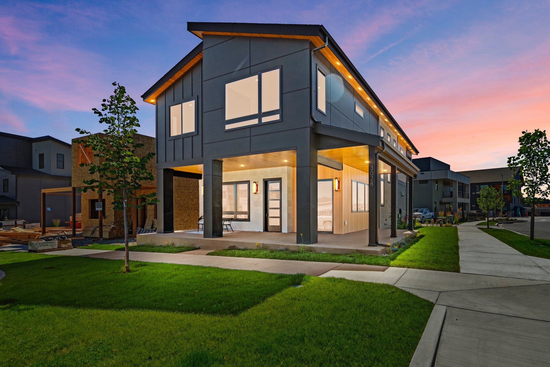 exterior evening view of illuminated luxury modern home