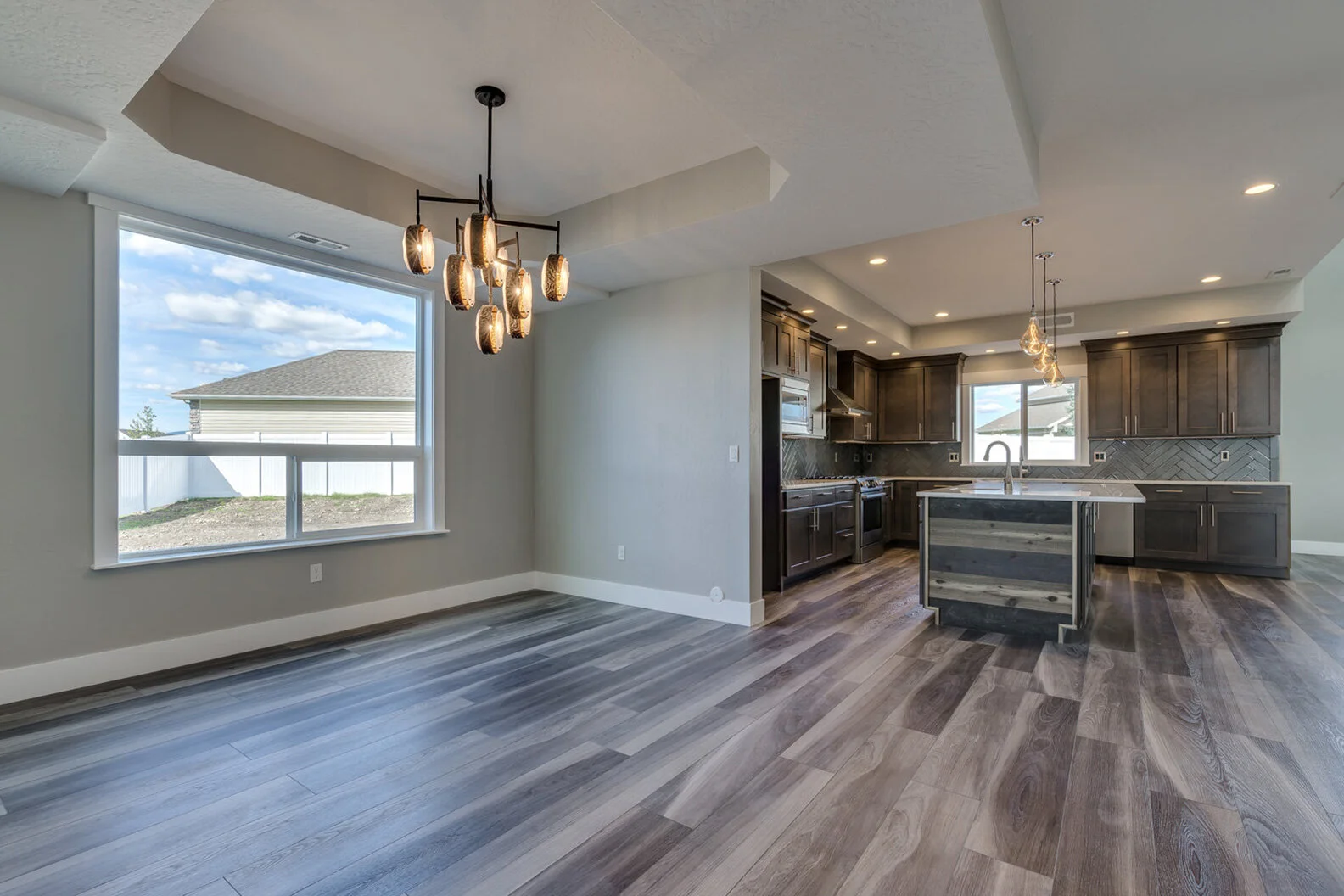 dining room and kitchen in luxurious custom modern home