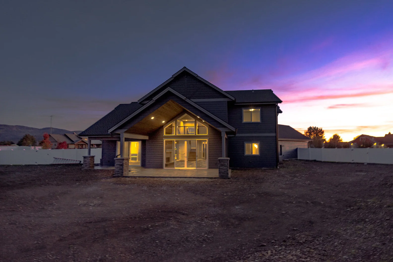exterior evening view of illuminated luxury modern home