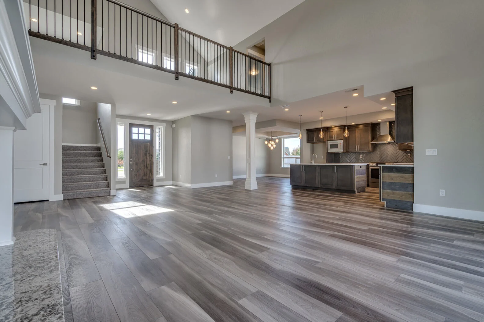 wide view of great room and entryway in custom modern luxury home